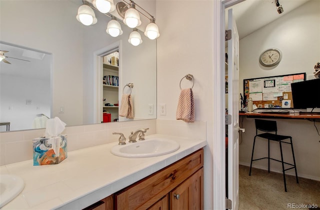 full bathroom with a sink, double vanity, and a ceiling fan