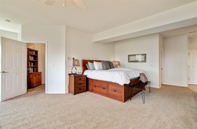 carpeted bedroom featuring baseboards and ceiling fan