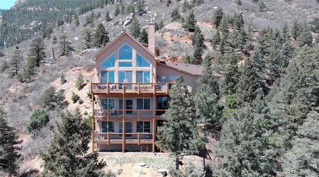 birds eye view of property with a mountain view
