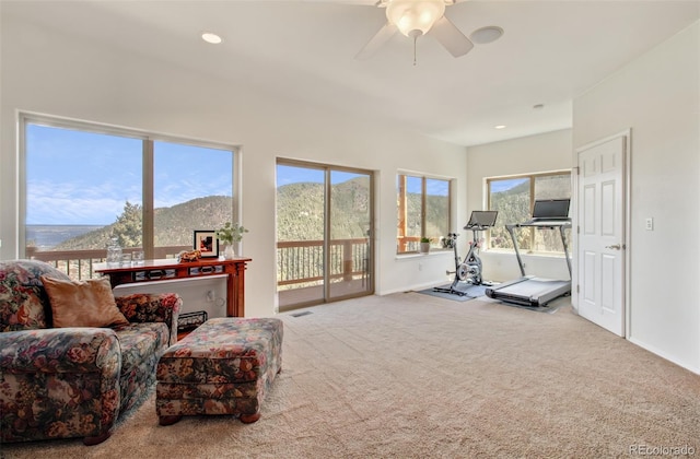 exercise area featuring carpet, a ceiling fan, visible vents, baseboards, and recessed lighting