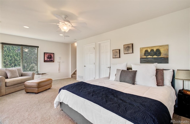 carpeted bedroom with ceiling fan and recessed lighting