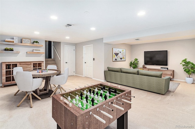 game room with recessed lighting, visible vents, light carpet, and baseboards