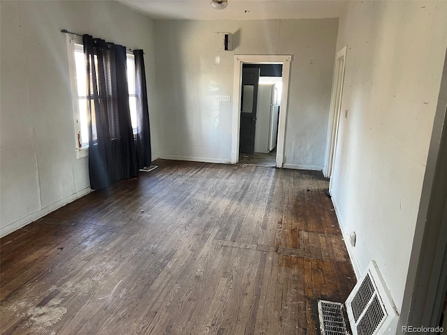 empty room featuring dark hardwood / wood-style floors