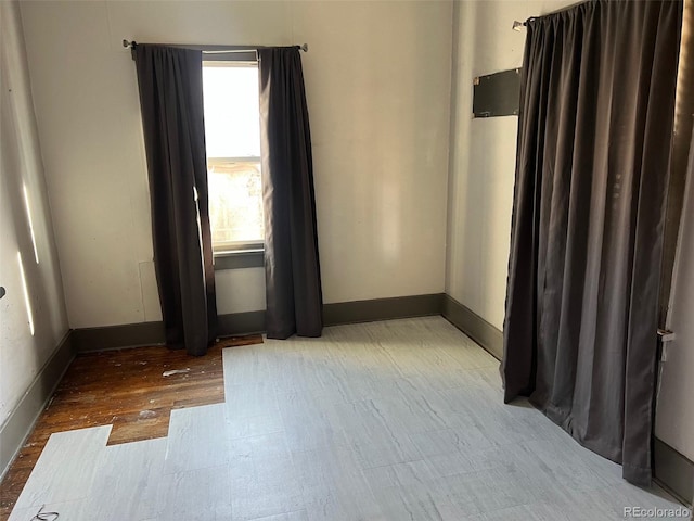 empty room with hardwood / wood-style flooring