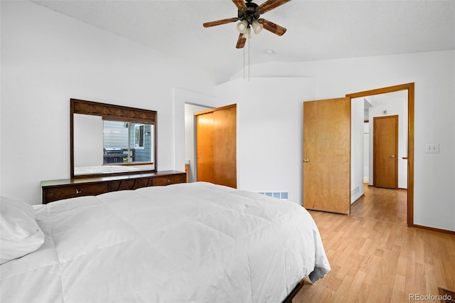 8761 Cloverleaf Cir, Parker, CO 80134 - bedroom with light wood-type flooring, lofted ceiling, and a ceiling fan