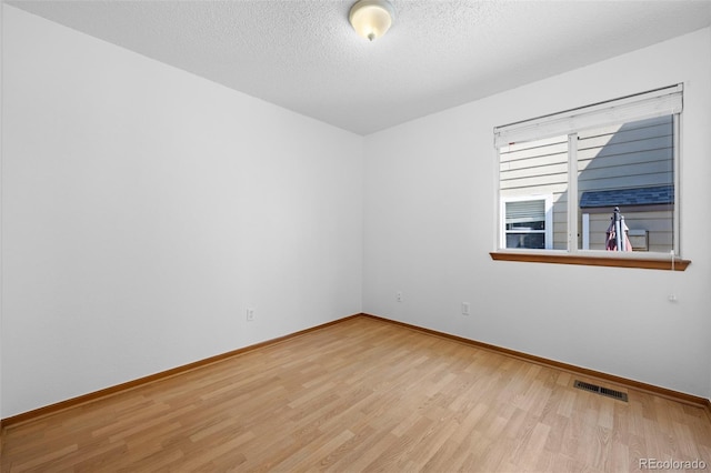 8761 Cloverleaf Cir, Parker, CO 80134 - spare room featuring wood finished floors and a textured ceiling