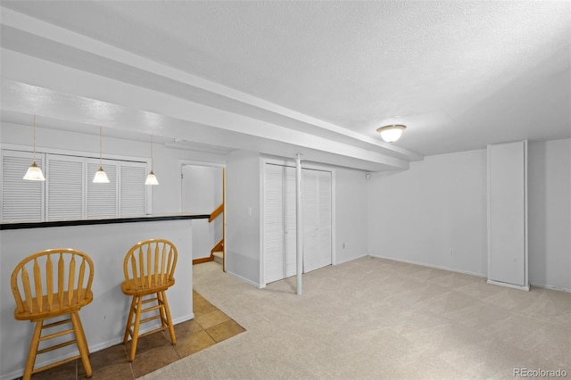 8761 Cloverleaf Cir, Parker, CO 80134 - finished basement with carpet, a textured ceiling, and stairs