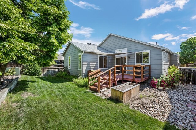 8761 Cloverleaf Cir, Parker, CO 80134 - back of property featuring a deck and a fenced backyard