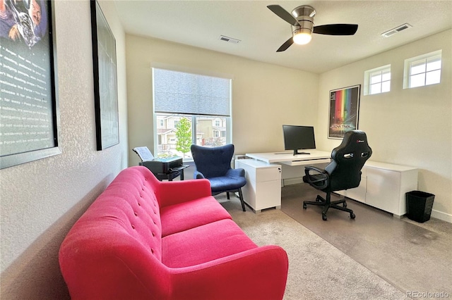 office area featuring a wealth of natural light and ceiling fan