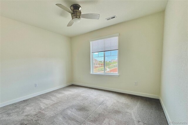 unfurnished room featuring ceiling fan and light colored carpet