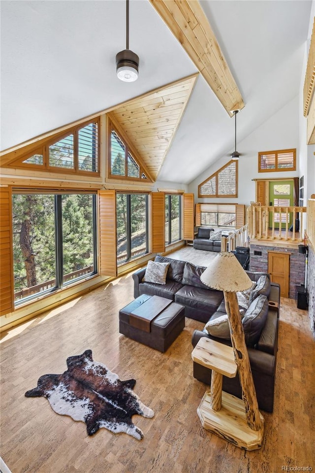 320 Summit Rd, Woodland Park, CO 80863 - living room featuring hardwood / wood-style floors and high vaulted ceiling