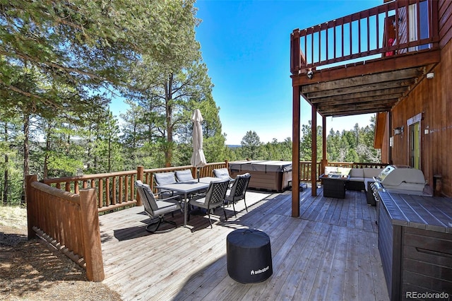 320 Summit Rd, Woodland Park, CO 80863 - wooden deck with outdoor lounge area, a hot tub, outdoor dining area, area for grilling, and view of scattered trees