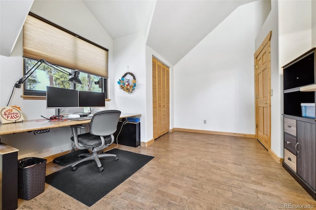 320 Summit Rd, Woodland Park, CO 80863 - office area featuring wood finished floors, baseboards, and high vaulted ceiling