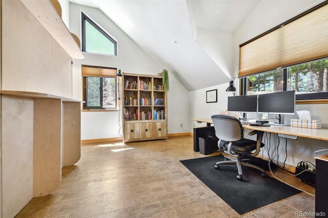 320 Summit Rd, Woodland Park, CO 80863 - office featuring lofted ceiling, light wood finished floors, healthy amount of natural light, and baseboards