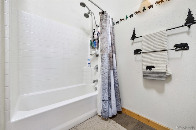 320 Summit Rd, Woodland Park, CO 80863 - bathroom with shower / bathtub combination with curtain and baseboards
