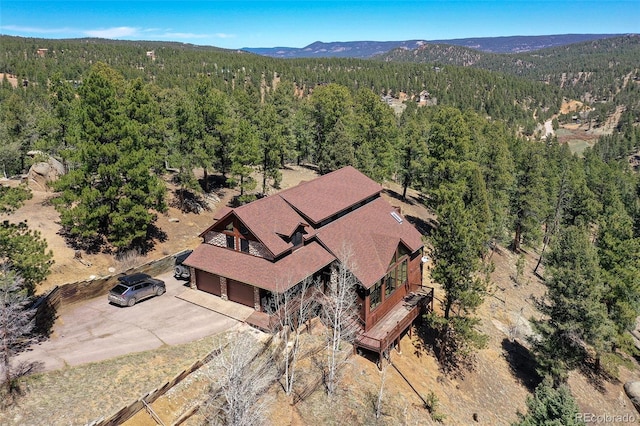 320 Summit Rd, Woodland Park, CO 80863 - view of subject property with a heavily wooded area and a mountainous background