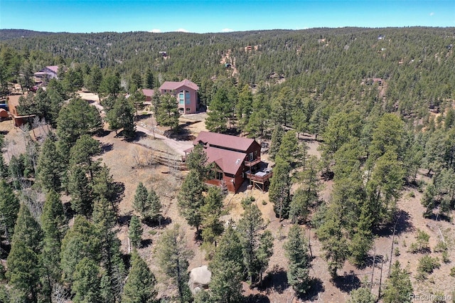 320 Summit Rd, Woodland Park, CO 80863 - aerial view of property and surrounding area featuring a heavily wooded area