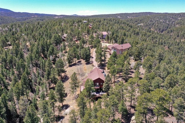 320 Summit Rd, Woodland Park, CO 80863 - bird's eye view of a heavily wooded area and a mountainous background