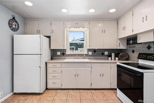 kitchen featuring light tile patterned floors, white appliances, sink, and decorative backsplash