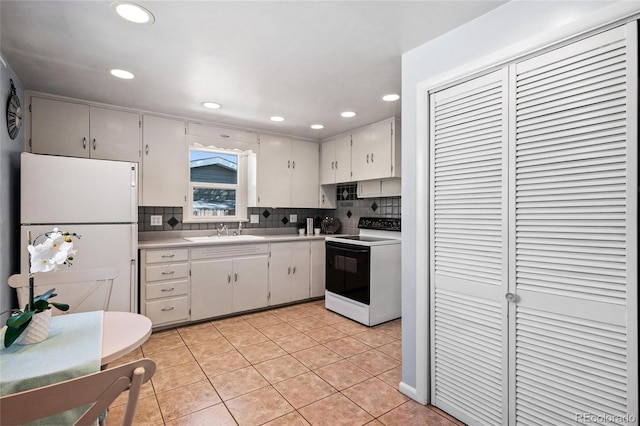 kitchen featuring sink, white appliances, decorative backsplash, and light tile patterned flooring