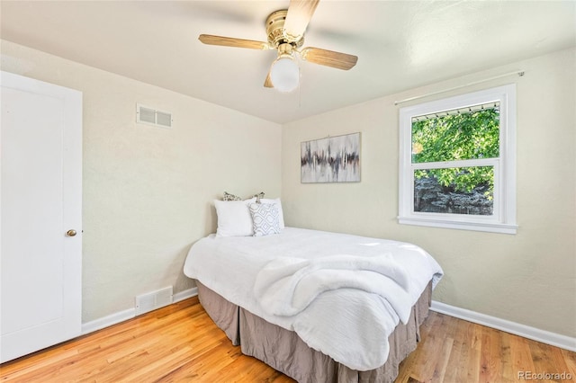 bedroom featuring light wood-type flooring and ceiling fan