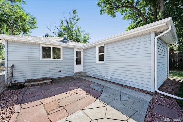 back of property with a patio