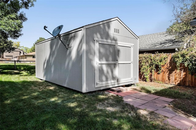 view of outdoor structure with a yard