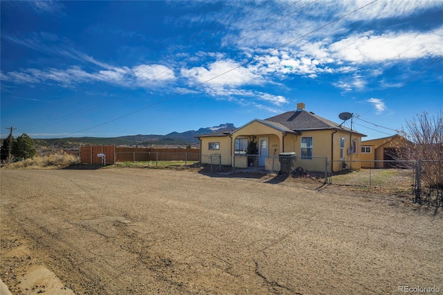 view of front of home featuring a mountain view