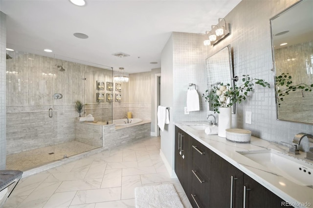 full bath featuring a stall shower, a garden tub, a sink, and double vanity