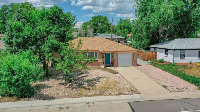 single story home featuring a garage