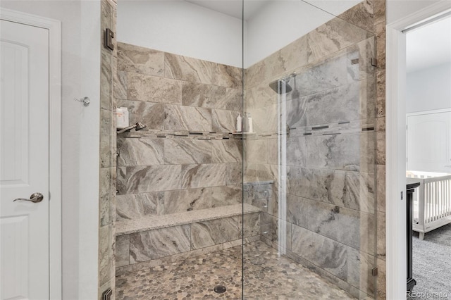 bathroom with a tile shower