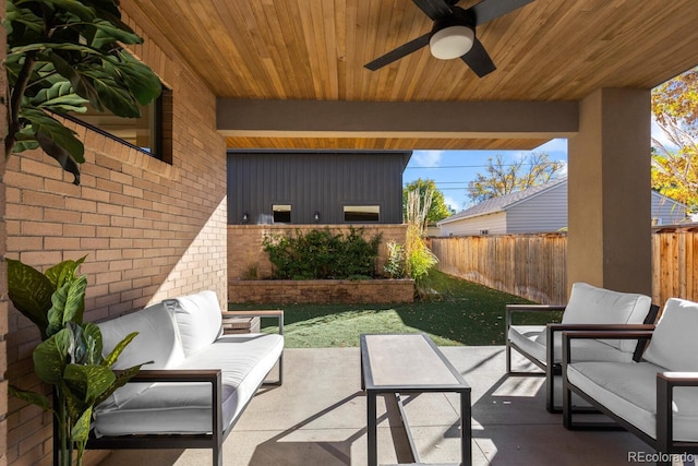 view of patio / terrace with ceiling fan and an outdoor living space