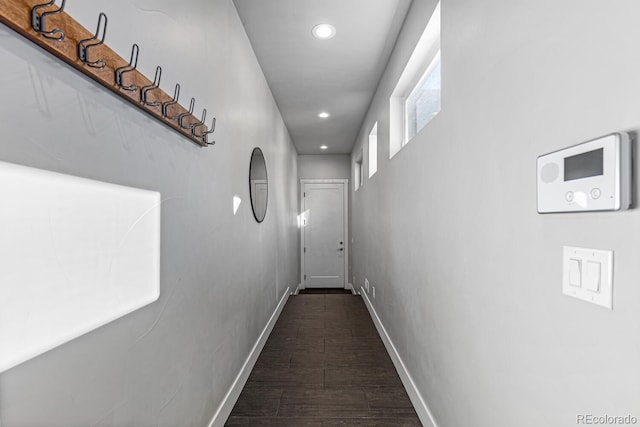 corridor with dark hardwood / wood-style floors