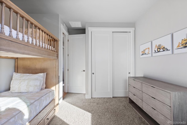 bedroom featuring dark colored carpet and a closet