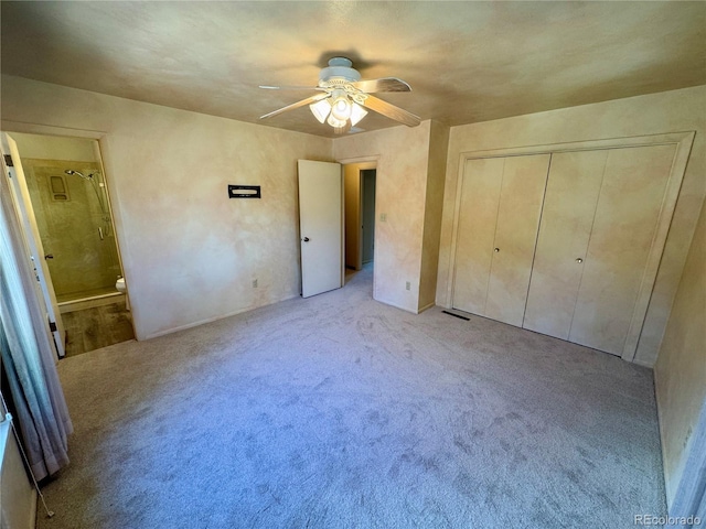 280 Raven Hills Rd, Colorado Springs, CO 80919 - unfurnished bedroom with ceiling fan, visible vents, light colored carpet, a closet, and ensuite bathroom
