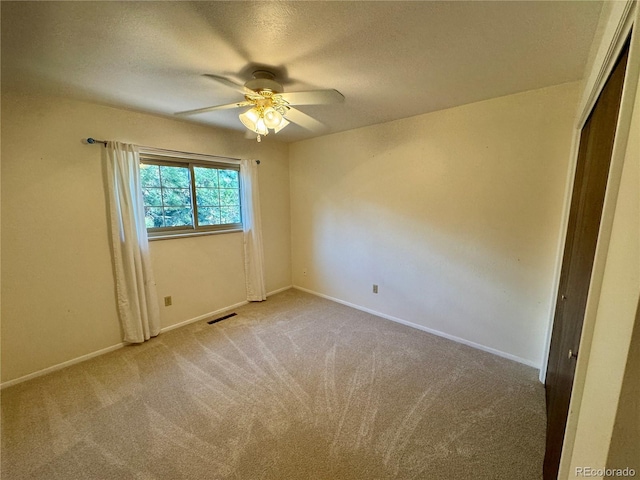 280 Raven Hills Rd, Colorado Springs, CO 80919 - unfurnished room featuring ceiling fan, light carpet, a textured ceiling, baseboards, and visible vents