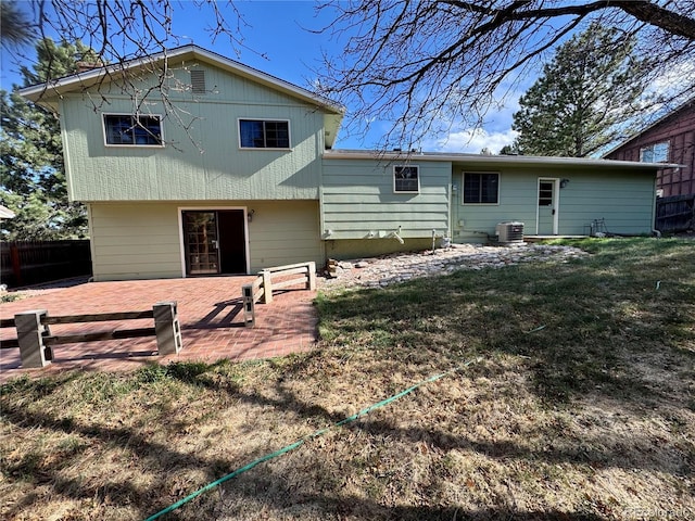 280 Raven Hills Rd, Colorado Springs, CO 80919 - back of property with central AC, a patio area, fence, and a yard