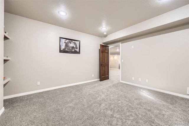 basement featuring carpet floors, recessed lighting, and baseboards