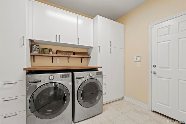 9468 E Aspen Hill Ln, Lone Tree, CO 80124 - laundry room with washer and clothes dryer and cabinet space