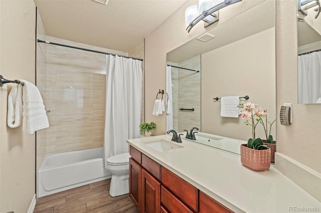 9468 E Aspen Hill Ln, Lone Tree, CO 80124 - full bathroom with shower / tub combo, wood finished floors, vanity, and a textured ceiling