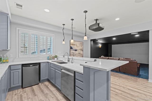 9468 E Aspen Hill Ln, Lone Tree, CO 80124 - kitchen with stainless steel dishwasher, gray cabinets, light wood-style flooring, a peninsula, and recessed lighting