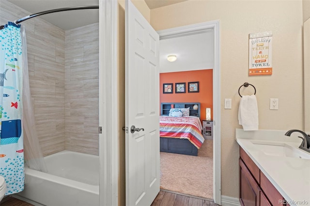9468 E Aspen Hill Ln, Lone Tree, CO 80124 - full bath with shower / tub combo with curtain, vanity, wood finished floors, and ensuite bathroom