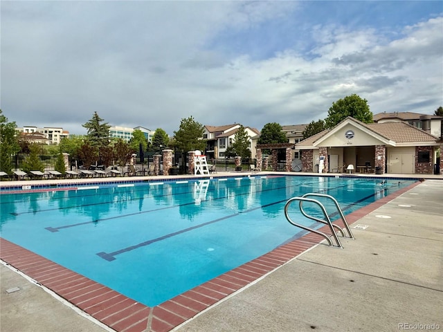 9468 E Aspen Hill Ln, Lone Tree, CO 80124 - community pool featuring a patio