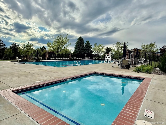 9468 E Aspen Hill Ln, Lone Tree, CO 80124 - community pool featuring a patio