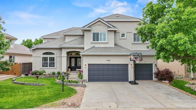 9468 E Aspen Hill Ln, Lone Tree, CO 80124 - traditional-style house with stucco siding, a garage, concrete driveway, and french doors