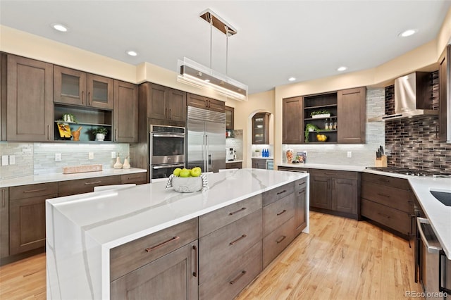 9468 E Aspen Hill Ln, Lone Tree, CO 80124 - kitchen with open shelves, stainless steel appliances, arched walkways, decorative backsplash, and recessed lighting