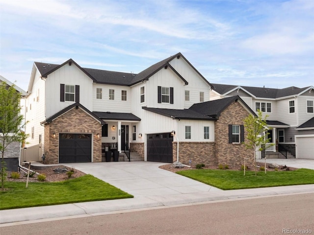 modern farmhouse style home featuring brick siding, concrete driveway, board and batten siding, fence, and a garage