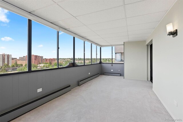 3131 E Alameda Ave Unit 803, Denver, CO 80209 - unfurnished sunroom with a baseboard heating unit and a city view