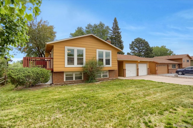 1010 Vondelpark Dr, Colorado Springs, CO 80907 - split level home featuring a garage, driveway, a front yard, and brick siding