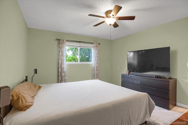 1010 Vondelpark Dr, Colorado Springs, CO 80907 - bedroom featuring light wood-style flooring, a textured ceiling, and ceiling fan